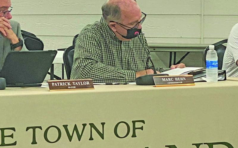 Photo by Christopher Lugo/Staff Commissioner Marc Hehn combs through the two UDO draft options.