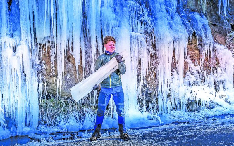 Bridal Veil Falls provided a frozen souvenir for a young visitor on Saturday. Temperatures in the single digits and wind chills below zero hit Highlands during the holiday weekend.