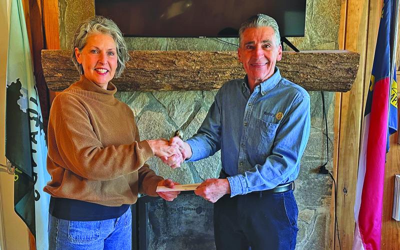 Kaye McHan presents Mountaintop Rotary Club President Michael Lanzilotta with a check for $12,150 to support the club’s annual arts and crafts shows.