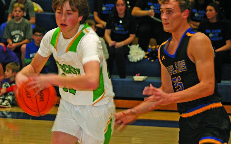 Highlands’ James Earp defends Blue Ridge forward Ethan Henson during their game on Friday night.