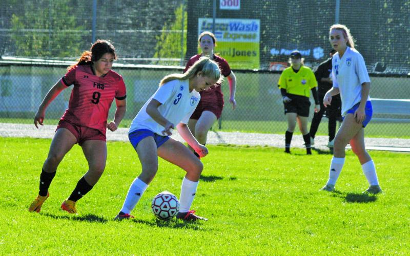 Highlands’ Addie Westendorf (3) controls the ball while being pressured by the Franklin defense during their game at Macon Middle School.