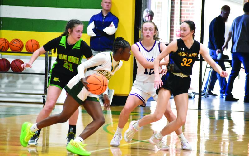 Highlands’ Ezra Branham (32) and Blue Ridge’s Mahala Stewart (21) defend during the 1-A West/Midwest All-Star game in Bessemer City.