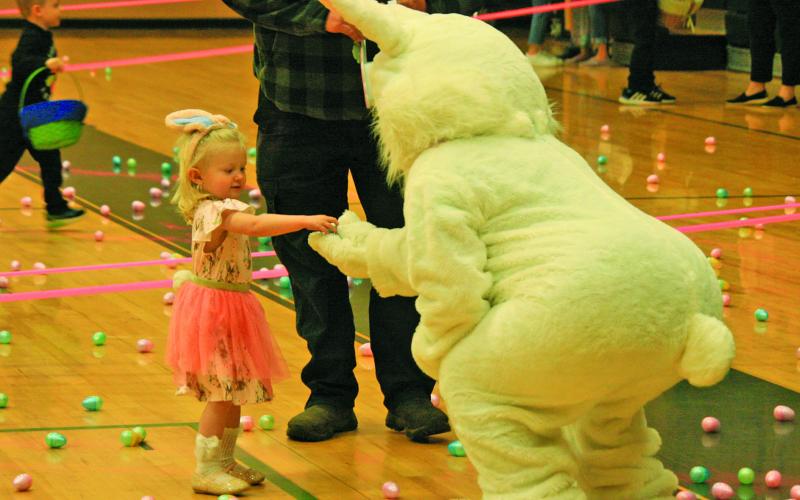Children donned their Easter best and raced through the Highlands Rec Center gym as part of the “Easter Egg Scramble” on Saturday. Cold temperatures and steady rain forced the annual town Easter Egg Hunt indoors.