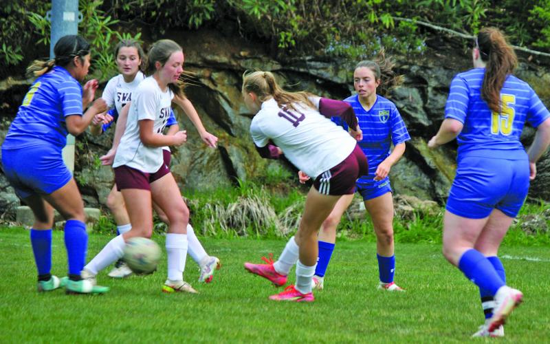 Highlands defenders smother Swain County forwards during their game on Friday night. Highlands won the game 4-1.