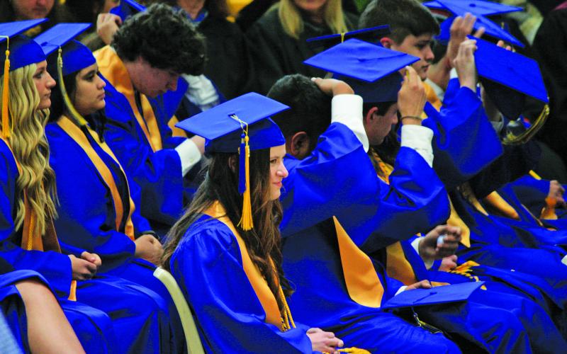 Highlands 2023 graduates put on their caps prior to receiving their diplomas during Saturday’s commencement ceremony.