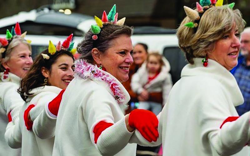 Members of the Mountain Garden Club have been performing a dance routine to kick of the Highlands Christmas Parade each year since 1998.