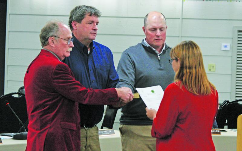 Recently elected Highlands town board members Brian Stiehler, John ‘Buz’ Dotson, and Jeff Weller were sworn in by Macon County Clerk of Court Shawna Lamb during the board’s monthly meeting on Thursday.