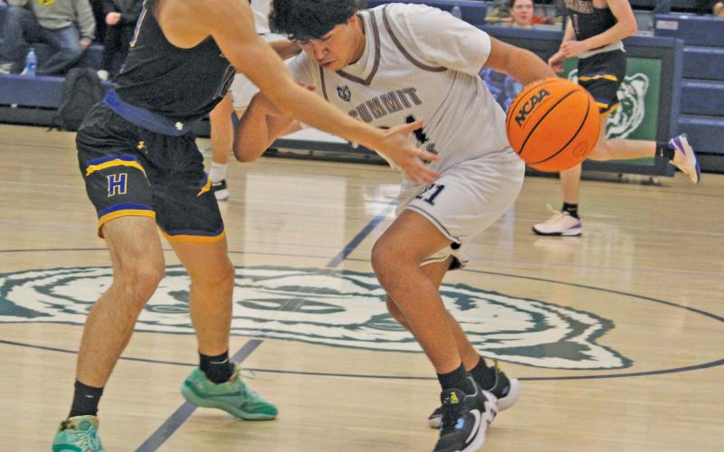 Photo by Michael O’Hearn/Staff - Highlands picked up its third win of the boys basketball season at Summit Charter on Thursday night. The Highlanders will travel to Nantahala on Friday.