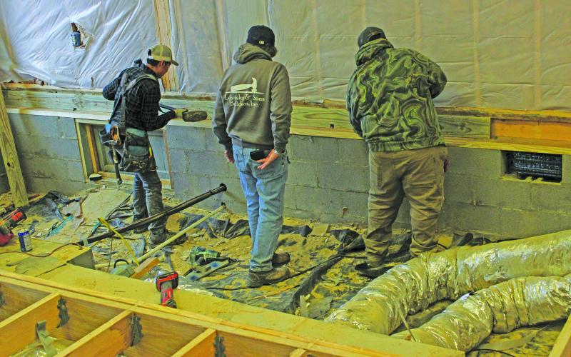 Workers continue remodeling operations at the Fishes &amp; Loaves food pantry building in Cashiers. Area food pantries are reporting increased need in 2024.