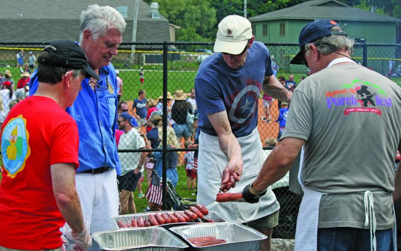 Volunteers with the Rotary Club of Highlands grilled 1,250 hot dogs at the town baseball field on July 4. Thanks to record crowds, the free franks were gone in under an hour.