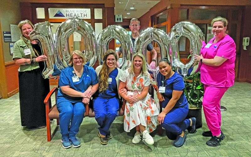 Staff members from Blue Ridge Health and the Highlands Cashiers Health Foundation gathered this week to celebrate completing 10,000 patient visits.