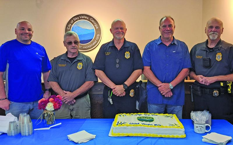 Sky Valley Police Chief Vaughn Estes (center) announced his resignation at the end of July after more than seven years in his current position.