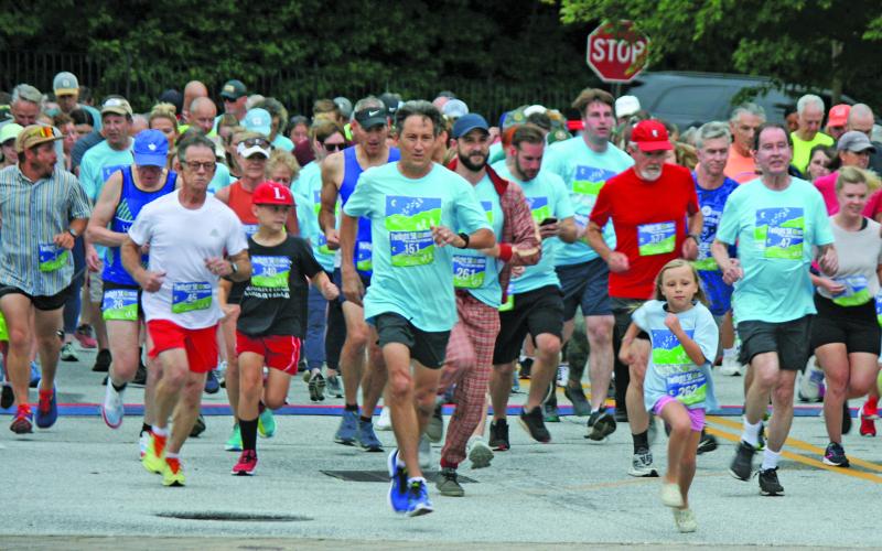 The start of the annual Rotary Club of Highlands Twilight 5k was as busy as ever, despite lingering rain showers on Saturday evening.