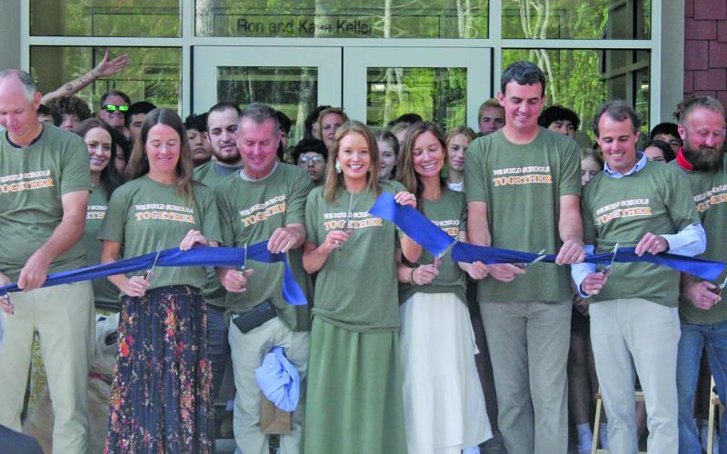 Representatives from Summit Charter School gathered to cut the ribbon on the new high school building on Friday.