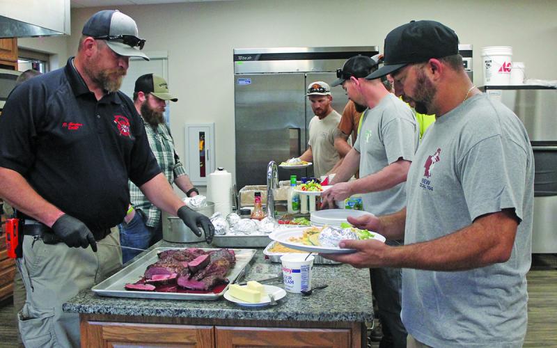 Firefighters at Highlands Fire Department served up dinner for linemen who have been out working to reconnect power since Sept. 28.
