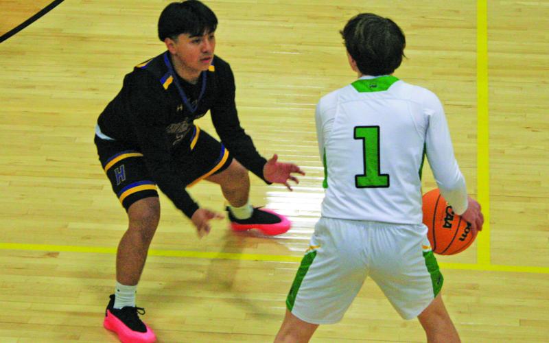 Highlands’ Brian Jarquin defends Blue Ridge’s Dakota Kinsey (1) during their game on Tuesday night.