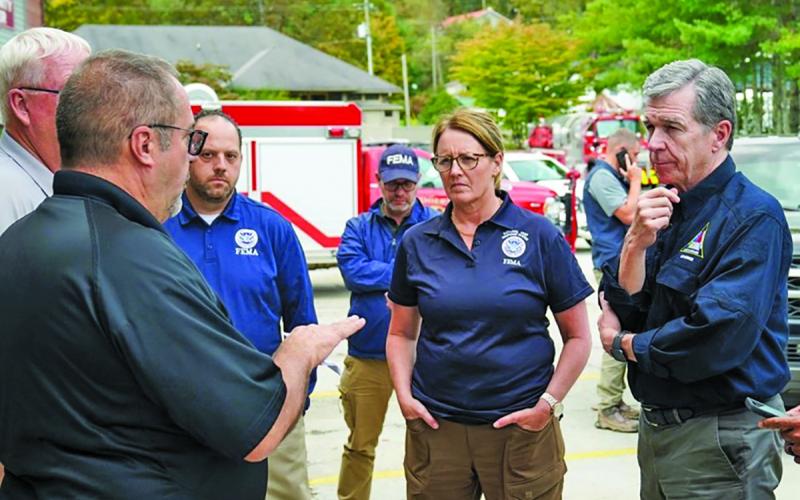 North Carolina Gov. Roy Cooper (right) made a stop in Cashiers following Hurricane Helene to meet with first responders.