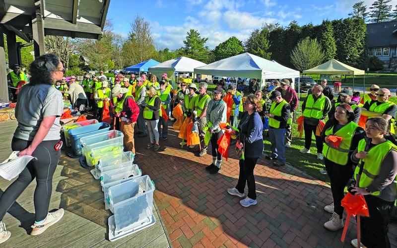 Volunteers gather in Kelsey-Hutchinson Founders Park for a safety briefing prior to the 2025 Plateau Pickup litter sweep on Saturday.