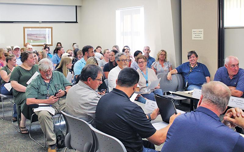 A sizable crowd fills the Macon County Board of Health’s meeting room, where 15 community members spoke at a special meeting.