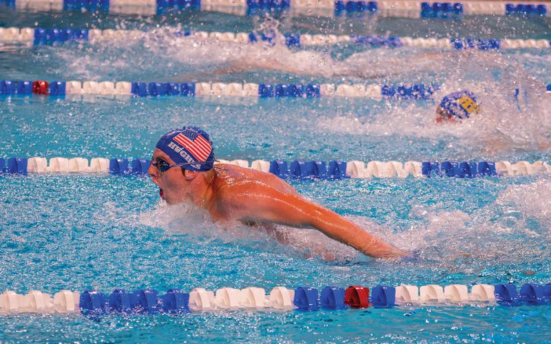 Conner Hughes in action against the Jackson County Swim Team.