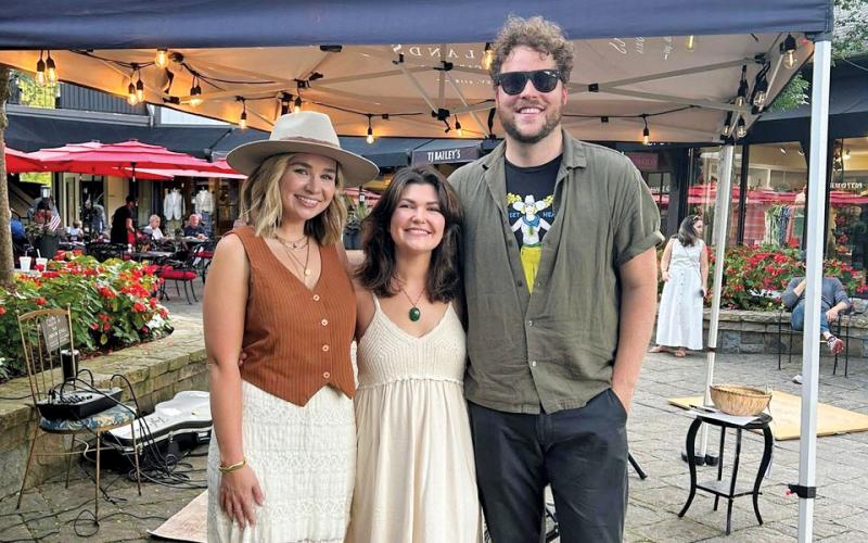 From the left, Katie Herz, Sara Chrestman and Ezra Herz smile for the camera before a benefit performance at Friday Night Live in Highlands.