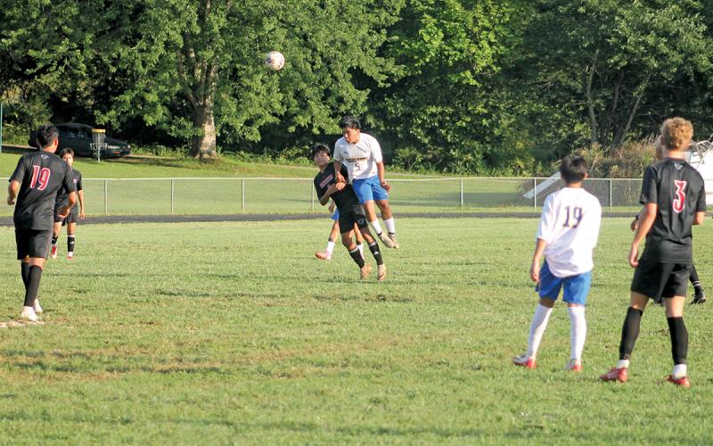 Senior Bryan Jarquin wins a header in Highlands men’s soccer’s season opener at Franklin Aug. 14.