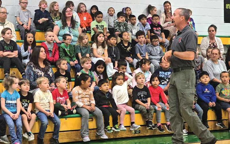 Photo by Bill Davis - Students at Blue Ridge School listen as Captain Brandon Green, president of Jackson County Fire &amp; Life Safety,  and a firefighter with the Savannah Fire Department, talks about fire safety.