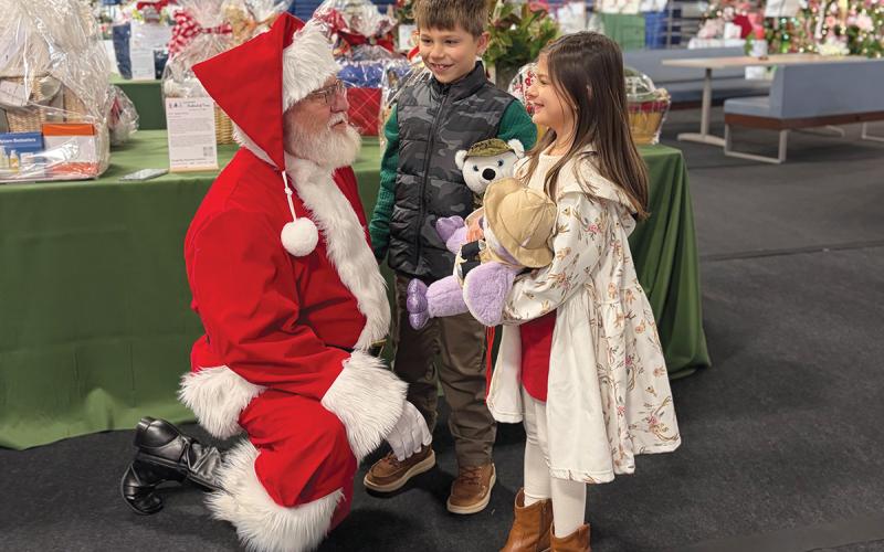 Nora Kate and Everett McLure meet with Santa at the Cashiers Festival of Trees over Thanksgiving weekend  |  Photo courtesy of Summit Charter School