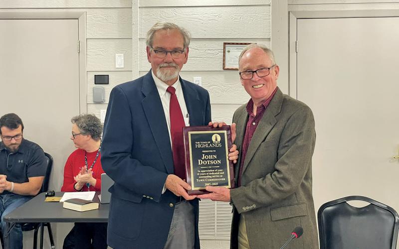 Highlands Mayor Patrick Taylor presents retiring Commissioner John Dotson with a commemorative plaque.