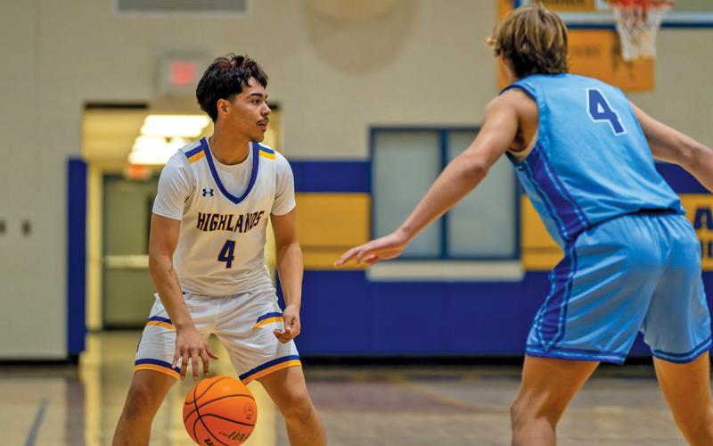 Sophomore Jayven Alvarado looks to make a move against a Towns County defender during Highlands’ 63-33 loss  |  Photo by Todd Sumner