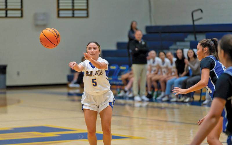 Senior AE Woods makes a pass in the Lady Highlanders 33-24 victory at home. They improved to 1-1  |  Photo by Todd Sumner