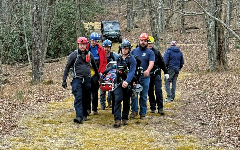 Members of the Glenville-Cashiers Rescue Squad carried the injured climber 1.5 miles to a staging area, securing him in a Stokes basket.  |  Photo by Glenville-Cashiers Rescue Squad