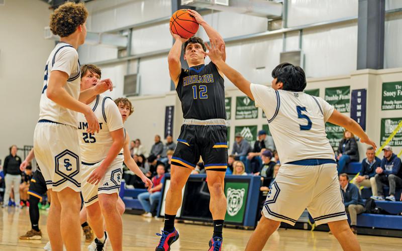Senior Isiah Villardo pulls up for a jumper amid four Summit defenders during a Plateau matchup this season. All three Plateau teams are participating in the NCHSAA basketball playoffs this week.  |  Photo courtesy of Todd Sumner
