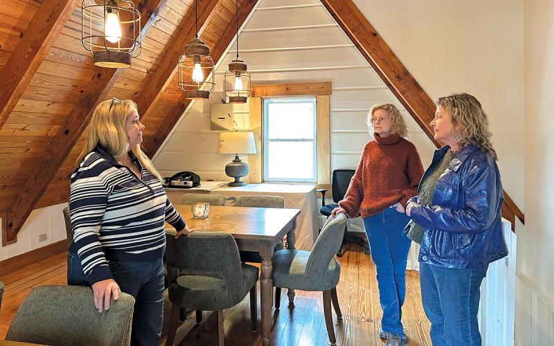 Executive Director Susan Sapienza shows off the new upstairs community space to Janet Cummings and Marjorie Christiansen.