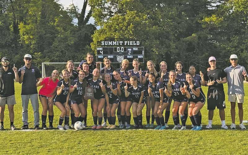 Photo courtesy of Summit Charter School - Summit Charter coaches and players celebrate following their historic victory over 19-win TNCLA in the state playoff semifinals.