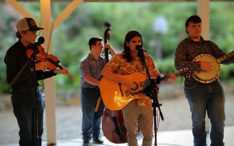Young Mountain Magic, a youth bluegrass and folk band from the Cashiers area, performs at the 2025 Boots and Bourbon. This year's live entertainment features Seth and Sara.