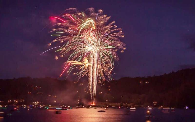 Fireworks erupt over Lake Glenville while boats watch from the water during a previous Fireworks Over Lake Glenville celebration. Photo courtesy of Friends of Lake Glenville