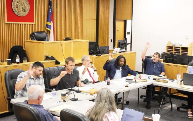 The Macon County Board of Commissioners unanimously voted to bar the Sheriff's Office from spending county funds on Flock cameras and to terminate its contract with Flock as soon as possible.