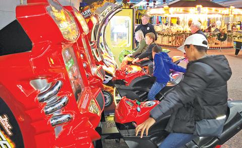 Children from Highlands enjoyed some arcade games at the Fun Factory in Franklin as part of the Shop with a Cop program.