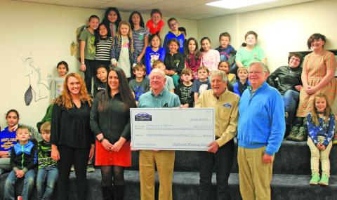 Representatives from the Highlands Motoring Festival visited The Literacy Council on Thursday to present donations to three local nonprofit organizations. 