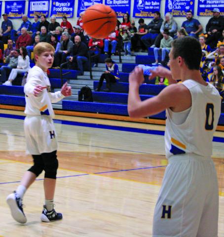 Connor Briggs inbounds the ball to Brent Sleight during the Highlanders 60-58 win over Robbinsville.