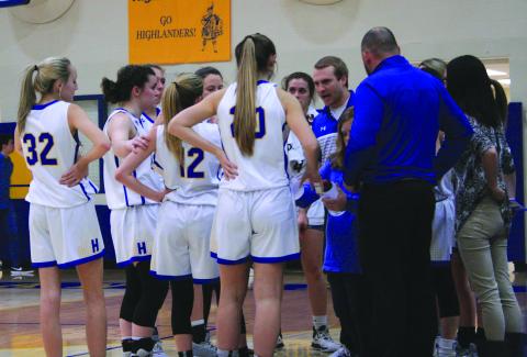 Highlands coach Jacob Page talks to his team during a timeout.