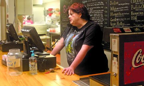 Lydia Hitchcock with The Pizza Place in Highlands is open for business serving carryout meals to residents. 