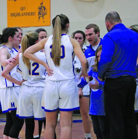 HHS girls basketball coach Jacob Page talks to his team during the first round of the NCSHAA 1-A playoffs in March.