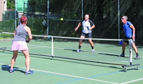 Pickleball players have been showing up early, and in high numbers, to get matches played before the summer sun raises the on-court temperature.