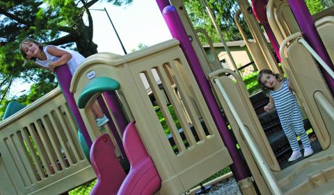 Juliette Norman and Frances Clark were caught having a good time on the playground at the Highlands Rec Park on Monday.