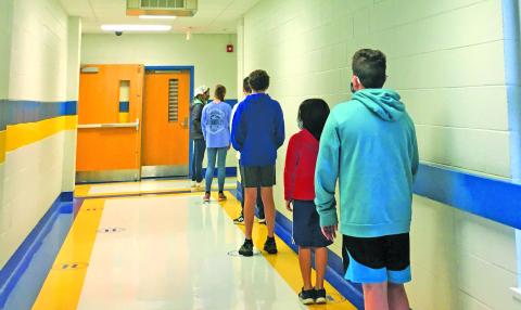 Students wait to receive a COVID-19 test at Highlands School. The testing program is being administered by the Highlands Cashiers Health Foundation.