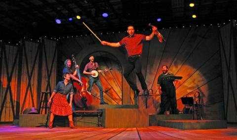 Photo by Christopher Smith/Staff Andrew Fehrenbacher (Jason) jumps off of a platform as Bailey Baker (Trenna,) Andrew Harvey (Eddie,)  Jimmy Lewis (Mark) and James Rowell IV (David) watch in awe. 