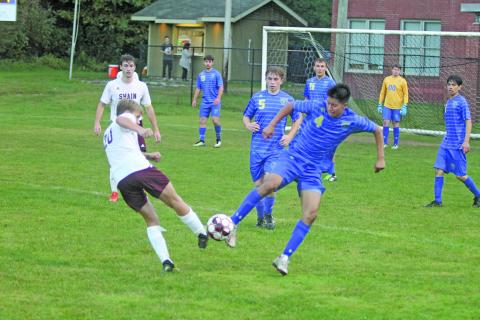 Photo by Christopher Smith/Staff A Highlands’ midfielder fights for the ball against Swain County, on Monday night. 