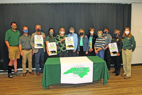 Photo by Christopher Smith/Staff NCWRC members with town officials and the BEAR task force. 